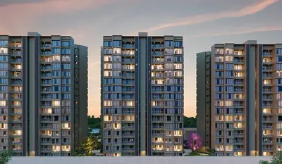 Three SKYi Park towers lit up at dusk